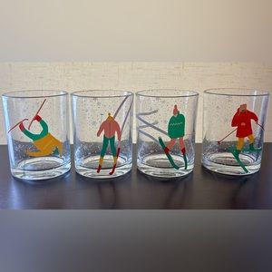 Set of 4 Melwood by TMD retail Lowball glasses with skiers. 4 different designs.